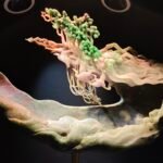 This jade artwork makes good use of natural multi‑colored jade. A crane nestles among ganoderma herbs with light and soft feather lines. Hollow‑carved branches match original stone shape. Elegant and ethereal, it fully shows the superb ingenuity of jade carving.