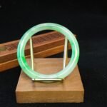 Clear‑Mountain Green‑Shadow Jadeite Bangle
